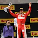 Sebastian Vettel (GER) Ferrari celebrates on the podium with the trophy at Formula One World Championship, Rd3, Chinese Grand Prix, Race, Shanghai, China, Sunday 17 April 2016. © Sutton Motorsport Images