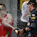 Sebastian Vettel (GER) Ferrari and Daniil Kvyat (RUS) Red Bull Racing celebrate on the podium with the champagne at Formula One World Championship, Rd3, Chinese Grand Prix, Race, Shanghai, China, Sunday 17 April 2016. © Sutton Motorsport Images