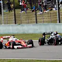 Sebastian Vettel (GER) Ferrari SF16-H and Jenson Button (GBR) McLaren MP4-31 battle at Formula One World Championship, Rd3, Chinese Grand Prix, Race, Shanghai, China, Sunday 17 April 2016. © Sutton Motorsport Images