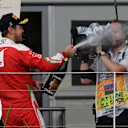 Sebastian Vettel (GER) Ferrari celebrates on the podium with the champagne at Formula One World Championship, Rd8, European Grand Prix, Race, Baku City Circuit, Baku, Azerbaijan, Sunday 19 June 2016. © Sutton Images
