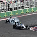 Valtteri Bottas (FIN) Williams FW38 locks up and Lewis Hamilton (GBR) Mercedes-Benz F1 W07 Hybrid at Formula One World Championship, Rd8, European Grand Prix, Race, Baku City Circuit, Baku, Azerbaijan, Sunday 19 June 2016. © Sutton Images