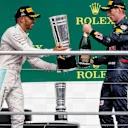 Race winner Lewis Hamilton (GBR) Mercedes AMG F1 and Max Verstappen (NED) Red Bull Racing celebrate on the podium with the champagne and the trophy at Formula One World Championship, Rd12, German Grand Prix, Race, Hockenheim, Germany, Sunday 31 July 2016. © Sutton Images