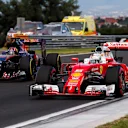 Sebastian Vettel (GER) Ferrari SF16-H and Daniil Kvyat (RUS) Scuderia Toro Rosso STR11 at Formula One World Championship, Rd11, Practice, Hungaroring, Hungary, Friday 22 July 2016. © Sutton Images