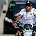 Lewis Hamilton (GBR) Mercedes AMG F1 arrives at the track on a motorbike at Formula One World Championship, Rd11, Qualifying, Hungaroring, Hungary, Saturday 23 July 2016. © Sutton Images