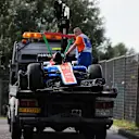 The crashed car of Rio Haryanto (IDN) Manor Racing MRT05 is recovered in Q1 at Formula One World Championship, Rd11, Hungarian Grand Prix, Qualifying, Hungaroring, Hungary, Saturday 23 July 2016. © Sutton Images