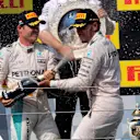 Ron Meadows (GBR) Mercedes AMG F1 Team Manager, Nico Rosberg (GER) Mercedes AMG F1 and race winner Lewis Hamilton (GBR) Mercedes AMG F1 celebrate on the podium with the champagne at Formula One World Championship, Rd11, Hungarian Grand Prix, Race, Hungaroring, Hungary, Sunday 24 July 2016. © Sutton Images