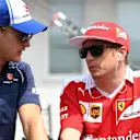 Marcus Ericsson (SWE) Sauber and Kimi Raikkonen (FIN) Ferrari on the drivers parade at Formula One World Championship, Rd11, Hungarian Grand Prix, Race, Hungaroring, Hungary, Sunday 24 July 2016. © Sutton Images