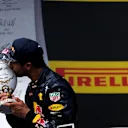 Daniel Ricciardo (AUS) Red Bull Racing celebrates on the podium with the trophy at Formula One World Championship, Rd11, Hungarian Grand Prix, Race, Hungaroring, Hungary, Sunday 24 July 2016. © Sutton Images