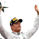 Race winner Nico Rosberg (GER) Mercedes AMG F1 celebrates on the podium with the trophy at Formula One World Championship, Rd14, Italian Grand Prix, Race, Monza, Italy, Sunday 4 September 2016. © Sutton Images