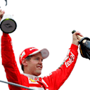 Sebastian Vettel (GER) Ferrari celebrates on the podium with the trophy and the champagne at Formula One World Championship, Rd14, Italian Grand Prix, Race, Monza, Italy, Sunday 4 September 2016. © Sutton Images