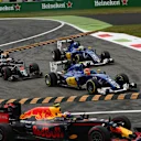 Jenson Button (GBR) McLaren MP4-31, Marcus Ericsson (SWE) Sauber C35 and Felipe Nasr (BRA) Sauber C35 run wide at the start of the race at Formula One World Championship, Rd14, Italian Grand Prix, Race, Monza, Italy, Sunday 4 September 2016. © Sutton Images