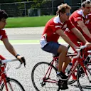 Sebastian Vettel (GER) Ferrari rides the track on a bike with Riccardo Adami (ITA) Ferrari Race Engineer and Antti Kontsas (FIN) trainer at Formula One World Championship, Rd14, Italian Grand Prix, Preparations, Monza, Italy, Thursday 1 September 2016. © Sutton Images