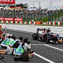 Daniil Kvyat (RUS) Scuderia Toro Rosso STR11 and photographers at Formula One World Championship, Rd17, Japanese Grand Prix, Practice, Suzuka, Japan, Friday 7 October 2016. © Sutton Images