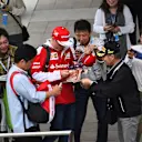 Kimi Raikkonen (FIN) Ferrari signs autographs for the fans at Formula One World Championship, Rd17, Japanese Grand Prix, Qualifying, Suzuka, Japan, Saturday 8 October 2016. © Sutton Images