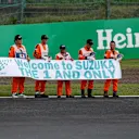 Marshals with banner at Formula One World Championship, Rd17, Japanese Grand Prix, Qualifying, Suzuka, Japan, Saturday 8 October 2016. © Sutton Images
