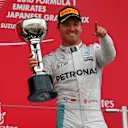 Race winner Nico Rosberg (GER) Mercedes AMG F1 celebrates on the podium with the trophy at Formula One World Championship, Rd17, Japanese Grand Prix, Race, Suzuka, Japan, Sunday 9 October 2016. © Sutton Images