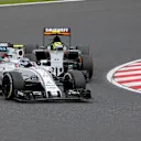 Valtteri Bottas (FIN) Williams FW38 and Sergio Perez (MEX) Force India VJM09 battle for position at Formula One World Championship, Rd17, Japanese Grand Prix, Race, Suzuka, Japan, Sunday 9 October 2016. © Sutton Images