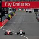 Sebastian Vettel (GER) Ferrari SF16-H and Sergio Perez (MEX) Force India VJM09 battle for position at Formula One World Championship, Rd17, Japanese Grand Prix, Race, Suzuka, Japan, Sunday 9 October 2016. © Sutton Images