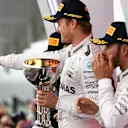 Race winner Nico Rosberg (GER) Mercedes AMG F1 celebrates on the podium with the trophy at Formula One World Championship, Rd17, Japanese Grand Prix, Race, Suzuka, Japan, Sunday 9 October 2016. © Sutton Images