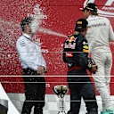 Nico Rosberg (GER) Mercedes AMG F1, Max Verstappen (NED) Red Bull Racing and Andy Shovlin (GBR) Mercedes AMG F1 Chief Engineer celebrate on the podium with the champagne at Formula One World Championship, Rd17, Japanese Grand Prix, Race, Suzuka, Japan, Sunday 9 October 2016. © Sutton Images