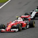 Kimi Raikkonen (FIN) Ferrari SF16-H and Nico Hulkenberg (GER) Force India VJM09 battle at Formula One World Championship, Rd17, Japanese Grand Prix, Race, Suzuka, Japan, Sunday 9 October 2016. © Sutton Images