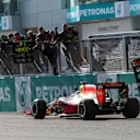 Race winner Daniel Ricciardo (AUS) Red Bull Racing RB12 crosses the line to win the race and celebrate with the team on the pitwall at Formula One World Championship, Rd16, Malaysian Grand Prix, Race,  Sepang, Malaysia, Sunday 2 October 2016. © Sutton Images
