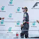 Max Verstappen (NED) Red Bull Racing, race winner Daniel Ricciardo (AUS) Red Bull Racing and Nico Rosberg (GER) Mercedes AMG F1 celebrate on the podium with the champagne at Formula One World Championship, Rd16, Malaysian Grand Prix, Race,  Sepang, Malaysia, Sunday 2 October 2016. © Sutton Images