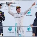 Race winner Daniel Ricciardo (AUS) Red Bull Racing and Nico Rosberg (GER) Mercedes AMG F1 celebrate opn the podium with the trophy at Formula One World Championship, Rd16, Malaysian Grand Prix, Race,  Sepang, Malaysia, Sunday 2 October 2016. © Sutton Images