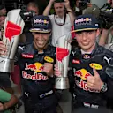 Race winner Daniel Ricciardo (AUS) Red Bull Racing and Max Verstappen (NED) Red Bull Racing celebrate with the trophies at Formula One World Championship, Rd16, Malaysian Grand Prix, Race, Sepang, Malaysia, Sunday 2 October 2016. © Sutton Images