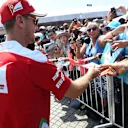 Sebastian Vettel (GER) Ferrari signs autographs for the fans at Formula One World Championship, Rd16, Malaysian Grand Prix, Race, Sepang, Malaysia, Sunday 2 October 2016. © Sutton Images