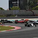 Lewis Hamilton (GBR) Mercedes-Benz F1 W07 Hybrid leads at the race start as Nico Rosberg (GER) Mercedes-Benz F1 W07 Hybrid and Sebastian Vettel (GER) Ferrari SF16-H colliide at Formula One World Championship, Rd16, Malaysian Grand Prix, Race, Sepang, Malaysia, Sunday 2 October 2016. © Sutton Images