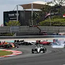 Lewis Hamilton (GBR) Mercedes-Benz F1 W07 Hybrid leads at the race start as Nico Rosberg (GER) Mercedes-Benz F1 W07 Hybrid and Sebastian Vettel (GER) Ferrari SF16-H colliide at Formula One World Championship, Rd16, Malaysian Grand Prix, Race, Sepang, Malaysia, Sunday 2 October 2016. © Sutton Images