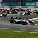 Lewis Hamilton (GBR) Mercedes-Benz F1 W07 Hybrid leads at the start of the race as Nico Rosberg (GER) Mercedes-Benz F1 W07 Hybrid and Sebastian Vettel (GER) Ferrari SF16-H collide at Formula One World Championship, Rd16, Malaysian Grand Prix, Race,  Sepang, Malaysia, Sunday 2 October 2016. © Sutton Images
