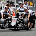 McLaren mechanics with McLaren MP4-31 in pit lane at Formula One World Championship, Rd16, Malaysian Grand Prix, Preparations, Sepang, Malaysia, Thursday 29 September 2016. © Sutton Images