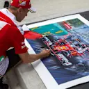 Sebastian Vettel (GER) Ferrari signs a painting at Formula One World Championship, Rd16, Malaysian Grand Prix, Preparations, Sepang, Malaysia, Thursday 29 September 2016. © Sutton Images