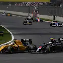 Kevin Magnussen (DEN) Renault Sport F1 Team RS16 and Jenson Button (GBR) McLaren MP4-31 battle at Formula One World Championship, Rd19, Mexican Grand Prix, Race, Circuit Hermanos Rodriguez, Mexico City, Mexico, Sunday 30 October 2016. © Sutton Images