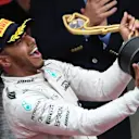 Lewis Hamilton (GBR) Mercedes AMG F1 celebrates with the trophy on the podium at Formula One World Championship, Rd6, Monaco Grand Prix, Race, Monte-Carlo, Monaco, Sunday 29 May 2016. © Sutton Images