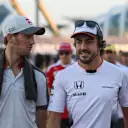 Romain Grosjean (FRA) Haas F1 and Fernando Alonso (ESP) McLaren on the drivers parade at Formula One World Championship, Rd15, Singapore Grand Prix, Race, Marina Bay Street Circuit, Singapore, Sunday 18 September 2016. © Sutton Images