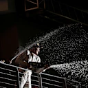 Daniel Ricciardo (AUS) Red Bull Racing and Race winner Nico Rosberg (GER) Mercedes AMG F1 celebrate on the podium with the champagne at Formula One World Championship, Rd15, Singapore Grand Prix, Race, Marina Bay Street Circuit, Singapore, Sunday 18 September 2016. © Sutton Images