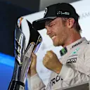 Race winner Nico Rosberg (GER) Mercedes AMG F1 celebrates on the podium with the trophy at Formula One World Championship, Rd15, Singapore Grand Prix, Race, Marina Bay Street Circuit, Singapore, Sunday 18 September 2016. © Sutton Images