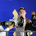Lewis Hamilton (GBR) Mercedes AMG F1, race winner Nico Rosberg (GER) Mercedes AMG F1 and Daniel Ricciardo (AUS) Red Bull Racing celebrate on the podium with the champagne at Formula One World Championship, Rd15, Singapore Grand Prix, Race, Marina Bay Street Circuit, Singapore, Sunday 18 September 2016. © Sutton Images