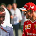 Paddy Lowe (GBR) Mercedes AMG F1 Executive Director (Technical) and Sebastian Vettel (GER) Ferrari at Formula One World Championship, Rd15, Singapore Grand Prix, Race, Marina Bay Street Circuit, Singapore, Sunday 18 September 2016. © Sutton Images