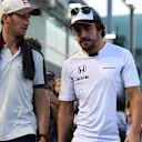 Romain Grosjean (FRA) Haas F1 AND Fernando Alonso (ESP) McLaren on the drivers parade at Formula One World Championship, Rd15, Singapore Grand Prix, Race, Marina Bay Street Circuit, Singapore, Sunday 18 September 2016. © Sutton Images