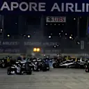 Nico Rosberg (GER) Mercedes-Benz F1 W07 Hybrid leads at the start of the race as Nico Hulkenberg (GER) Force India VJM09 crashes at Formula One World Championship, Rd15, Singapore Grand Prix, Race, Marina Bay Street Circuit, Singapore, Sunday 18 September 2016. © Sutton Images