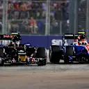 Carlos Sainz (ESP) Scuderia Toro Rosso STR11 and Esteban Ocon (FRA) Manor Racing MRT05 battle at Formula One World Championship, Rd15, Singapore Grand Prix, Race, Marina Bay Street Circuit, Singapore, Sunday 18 September 2016. © Sutton Images