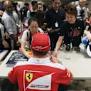 Kimi Raikkonen (FIN) Ferrari at the fans autograph session at Formula One World Championship, Rd15, Singapore Grand Prix, Preparations, Marina Bay Street Circuit, Singapore, Thursday 15 September 2016. © Sutton Images