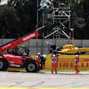 The car of Jolyon Palmer (GBR) Renault Sport F1 Team RS16 is recovered after a left-rear tyre deflation in FP2 at Formula One World Championship, Rd5, Spanish Grand Prix, Practice, Barcelona, Spain, Friday 13 May 2016. © Sutton Images