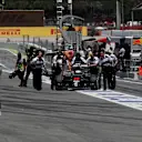 Jenson Button (GBR) McLaren MP4-31 is pushed in pit lane by the McLaren mechanics after stopping in FP2 at Formula One World Championship, Rd5, Spanish Grand Prix, Practice, Barcelona, Spain, Friday 13 May 2016. © Sutton Images