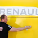 Renault Sport F1 Team mechanic applies a Renault Sport F1 Team logo at Formula One World Championship, Rd5, Spanish Grand Prix, Preparations, Barcelona, Spain, Thursday 12 May 2016. © Sutton Images