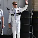 Jenson Button (GBR) McLaren with his trainer Mike Collier (GBR)  waves to the crowd after Q1 at Formula One World Championship, Rd18, United States Grand Prix, Qualifying, Circuit of the Americas, Austin, Texas, USA, Saturday 22 October 2016. © Sutton Images